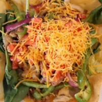 Taco Salad · Flour tortilla crispy, lettuce. tomatoes, cheese, and bell pepper on the grill.
