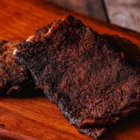 Rib Plate · 1/3 or 1/2 slab of smoked & seasoned St Louis ribs served with two sides, a toasted bun and ...