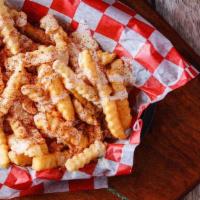 Cheese Fries · A basket of Tops crinkle cut fries drizzled with white queso