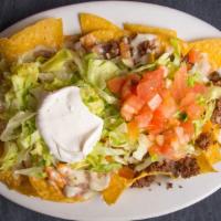 Nachos Deluxe · Cheese Nachos With Beans, Shredded Chicken And Ground Beef. Topped With Lettuce, Tomato, And...