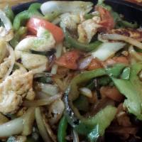 Fajita Taco Salad · Steak, Grilled chicken or mixed sauteed with bell pepper, onions, and tomatoes. Topped with ...