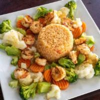 Vegetables Cancun With Shrimp · Grilled shrimp on a bed of steamed cauliflower, carrots and broccoli covered with a cheese s...