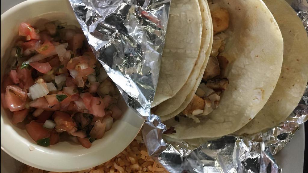 Taco Fish Or Shrimp · Three (3) corn tortillas with your choice of grilled tilapia or shrimp. Served with rice, pico de gallo and lime