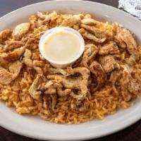Pollo Con Queso · Grilled chicken strips, covered with cheese dip, served with rice and tortillas. Try it with...