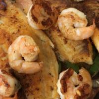 Alambres · Tender strips of marinated chicken, steak or shrimp sauteed with onions and bacon, topped wi...