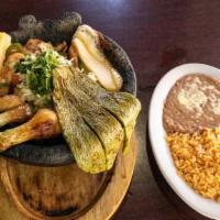 Molcajete · Steak, grilled chicken, or mixed  in a ranchera sauce sauteed with bell pepper onions, and t...
