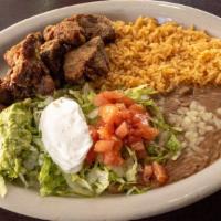 Carnitas · Slowly cooked pork tips. Served with rice, beans, lettuce, tomato, jalapeno pepper and torti...