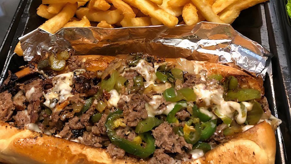 Tha Smoke Booth Cheesesteak With Fries · Sandwich include steak, onion & bell pepper.