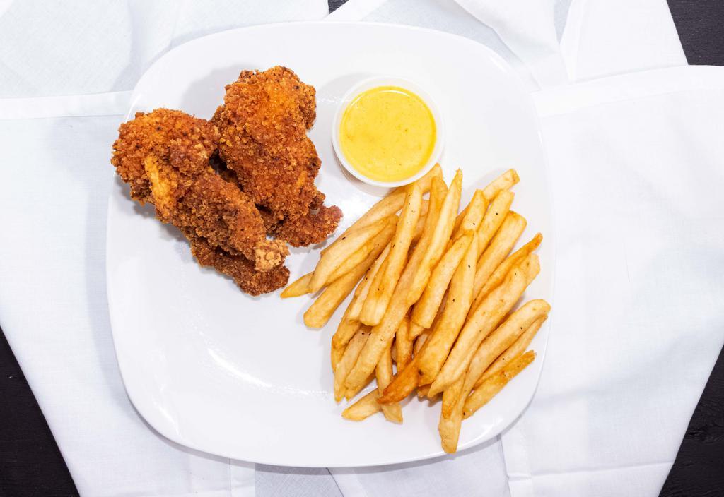 Chicken Strips With Fries · Freshly breaded and fried chicken strips with a side of French fries.