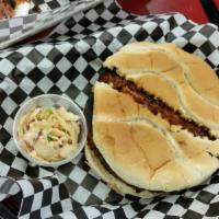Bbq Bologna Sandwich · Our BBQ bologna is smoked for hours and then fried, served on a toasted bun with coleslaw an...