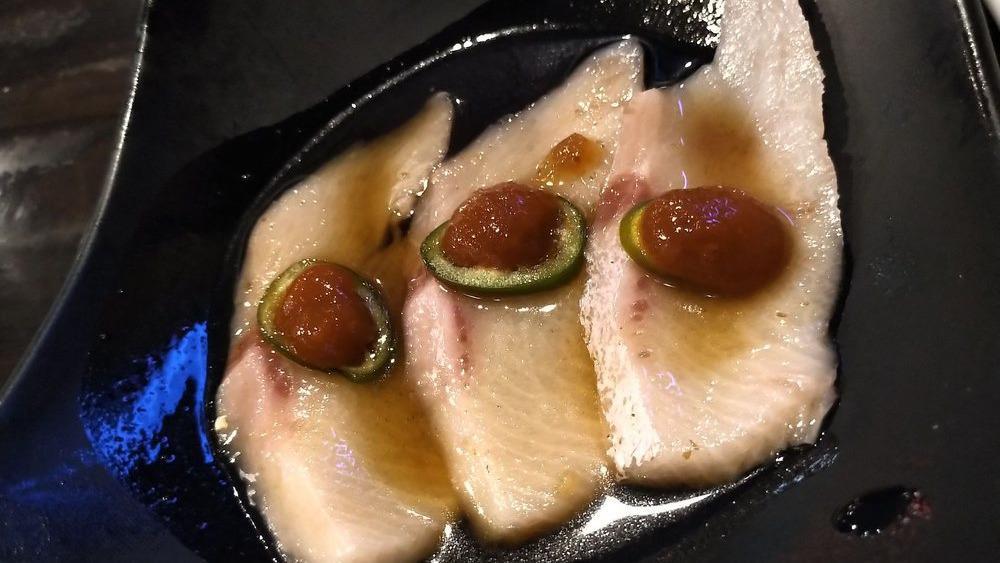 Yellowtail Jalapeño · Raw. Sliced yellowtail, jalapeño with chef sauce.

Consuming raw or undercooked meats, poultry, seafood, shellfish or eggs may increase your risk of foodborne illness.