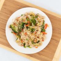 Fried Rice · Thai-style fried rice with egg, onions, scallions, peas, and carrots.