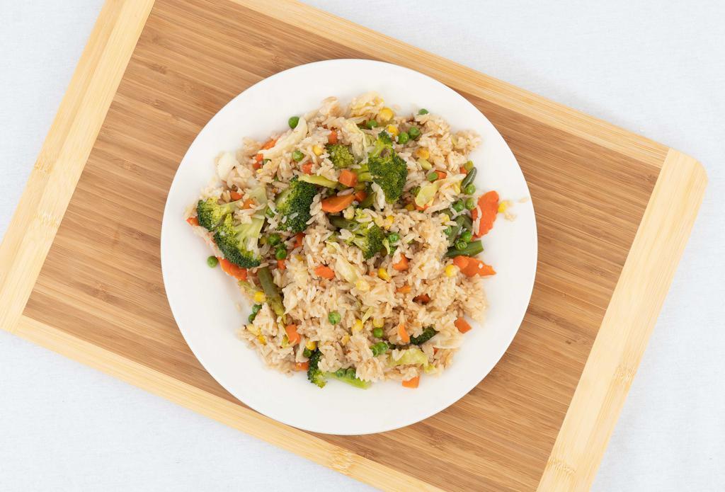 Fried Rice · Thai-style fried rice with egg, onions, scallions, peas, and carrots.