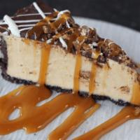 Peanut Butter Pie · A luscious peanut butter filling with chocolate chunks over a fudge-topped cookie crust. Dri...
