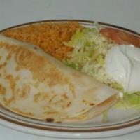 Choripollo Burrito · Extra big burrito filled with grilled chicken strips and chorizo, topped with cheese dip and...