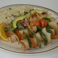 Camarones Mex-Am · Grilled shrimp, served with rice, lettuce, avocado, pico de gallo and tortillas.
