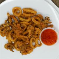 Fried Calamari · Lightly breaded with our house made breading mix and served with sweet and chili sauce.