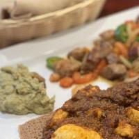 Addis Special · Prime Angus ground beef marinated with herbal butter and mitmita(cayenna pepper mix) then mi...