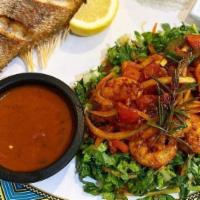 Shrimp Tibs · Whole shrimps sautéed with onions, tomatoes, jalapeño, and herbal butter.