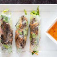 Spring Rolls · Vermicelli noodles, fresh veggies, and your choice of shrimp, pork, chicken or beef wrapped ...