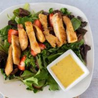 Strawberry Pecan Chicken Salad · Sliced strawberries, candied pecans and grilled chicken on a bed of spring mix lettuce toppe...