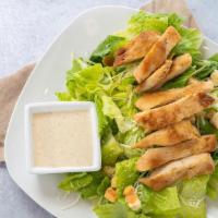Chicken Caesar Salad · Grilled chicken on a bed of romaine lettuce topped with garlic croutons and parmesan cheese ...