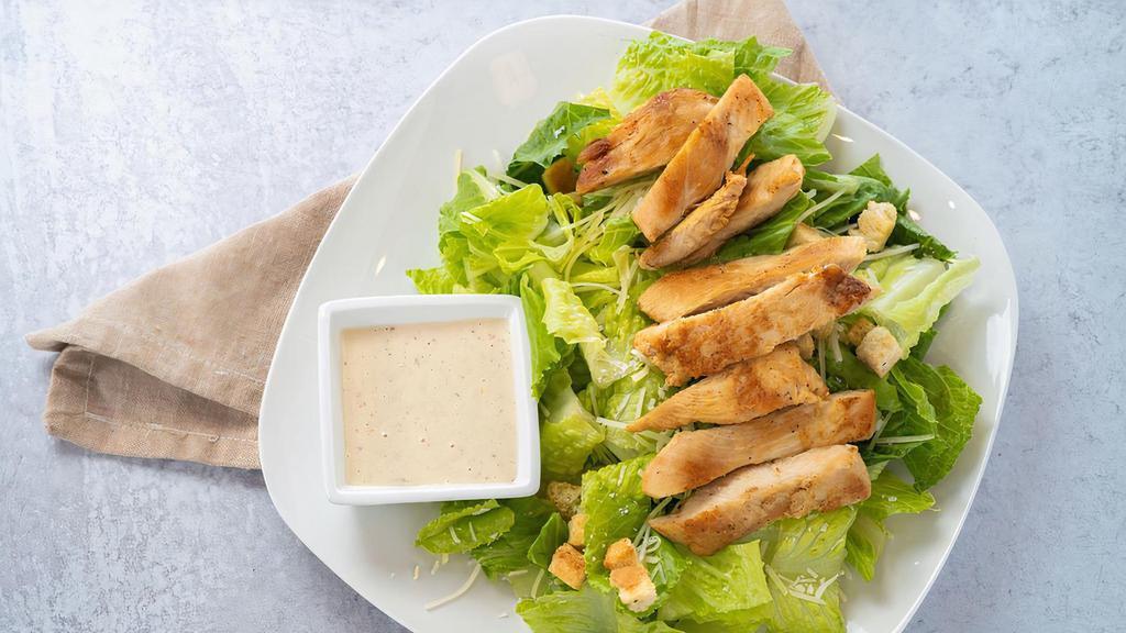 Chicken Caesar Salad · Grilled chicken on a bed of romaine lettuce topped with garlic croutons and parmesan cheese with creamy caesar dressing