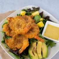 Coconut Shrimp Salad · Sliced mangos, avocado and fried coconut shrimp on a bed of spring mix lettuce with onion vi...