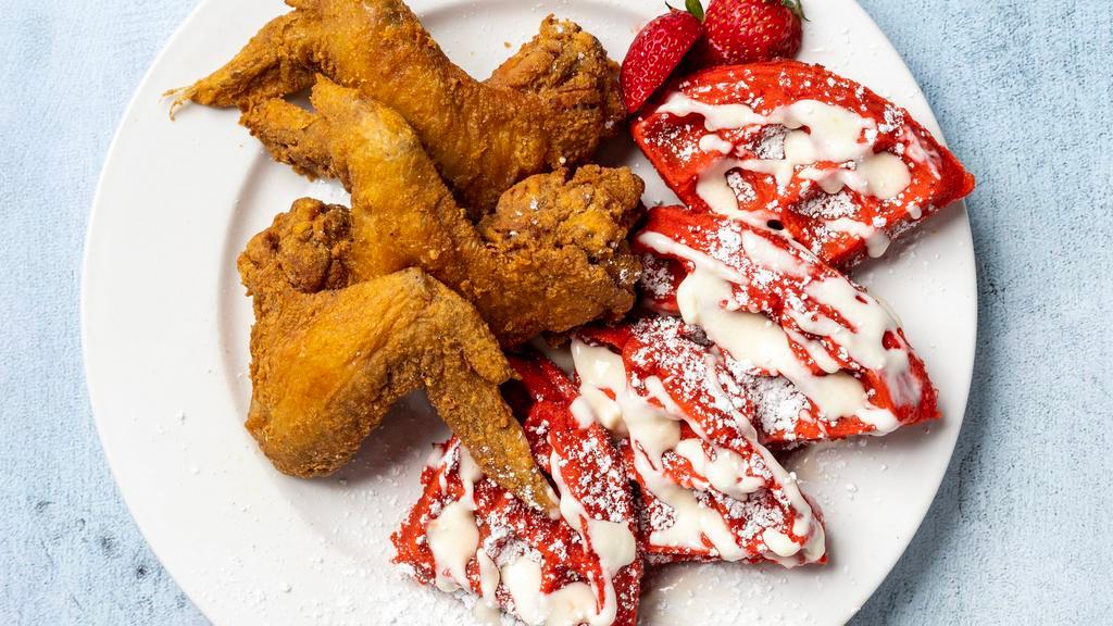 Chicken & Waffles · Your choice of a classic vanilla waffle topped with honey and dusted with powdered sugar or a red velvet waffle topped with a cream cheese drizzle and powdered sugar served with three fried jumbo wings.