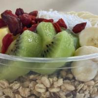 Passion Bowl · Passion fruit blend topped with granola, banana, kiwi, pineapple, goji berries, coconut, honey