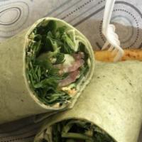Veggie Wrap · Mixed greens, tomato, avocado, cucumber, black olives, sprouts, hummus. Served with a side o...