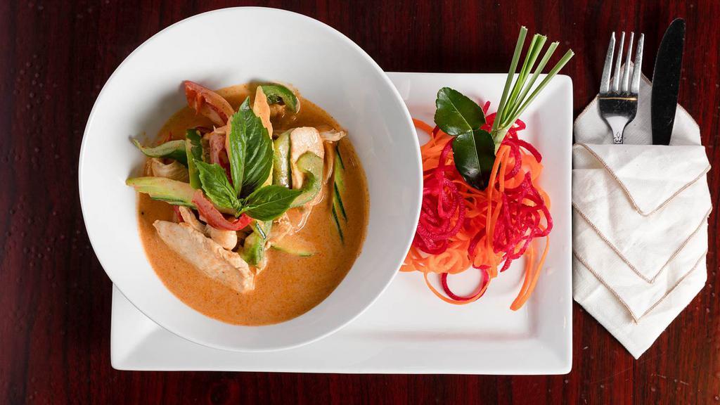 Red Curry · Our popular curry dish, red curry mixed with kaffir lime leaves, bell peppers, zucchini, and basil leaves.