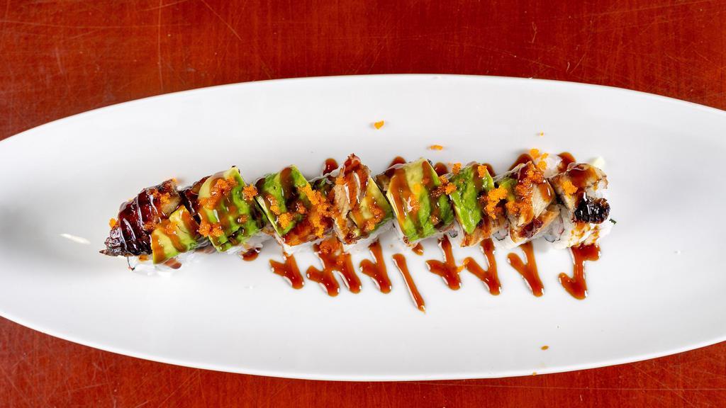 Dragon Roll · Crab meat and cucumber, topped with eel and avocado, fish egg. Sauce: eel sauce.