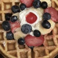 The Norfolk Way Waffles · One large Belgian waffle topped with blueberries, bananas, strawberries, with whipped cream,...