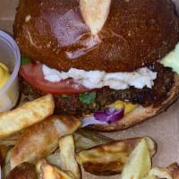 The Scrumptious Burger · Organic Vegan patty, avocado, cashew cheese ,onions, cilantro, tomato, mustard, ketchup on B...