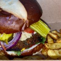 The Sunshine Burger · Organic Vegan patty, pickles, cashew cheese ,onions, cilantro, tomato,  mustard, ketchup on ...