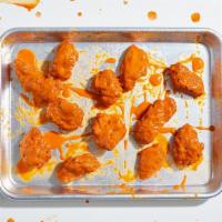 10 Boneless Wings · Tossed with your choice of sauce and served with a side of ranch or blue cheese dressing.