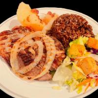 Jojo'S  Lechon Asado · Roasted pork with white onion, Served with rice &  beans or congris, Garden Salad and Yuca, ...
