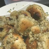 Garlic Knots* · Dough smothered in garlic olive oil herbs and parmesan. served with marinara sauce.