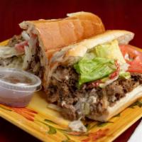 Steak Philly* · Sautéed steak, melted white American, mayo, lettuce, & tomato with our signature house dress...