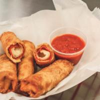 Pizza Logs · Four pieces. Pepperoni, cheese and sauce in a crispy wrapper. Served with marinara sauce.