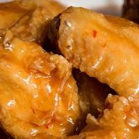Chicken Wings (6 Pieces) · Six pieces. Bone in chicken wings served with ranch or bleu cheese, naked, buffalo, BBQ or c...