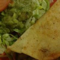 Quesadilla Rellena · A flour tortilla grilled and stuffed with melted cheese and served with lettuce, pico de gal...