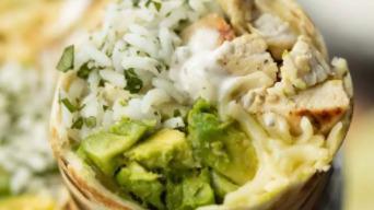 Burrito Guacamole · A flour tortilla filled with meat, topped with lettuce, tomatoes and sour cream. Served with...