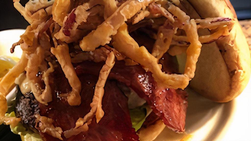 Turkey Burger · Fresh ground turkey, seasoned with our special house seasoning, grilled to perfection, topped with swiss cheese, turkey bacon, crispy onion strings, lettuce, tomato, and dressed with our house roasted tomato aioli