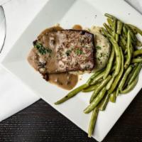 The Meatloaf · It is homemade meatloaf with a slight spicy twist, served over garlic mashers all smothered ...