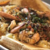 Shrimp & Grits · Our large jumbo shrimp, pan sautéed with bacon, onions, peppers, fresh herbs, garlic, and ju...