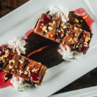 Nutella Cheesecake · stout infused nutella, candied cherries, whipped cream.