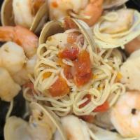 Fruit De Mare · Sautéed Shrimp, Clams, Mussels, Scallops in herb tomato broth with angel hair pasta.