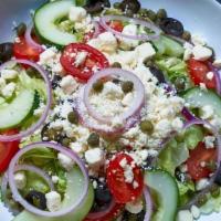 Greek Salad · Luttuce blend, cucumbers, cherry tomatoes, red onions, black olives, feta, capers served wit...